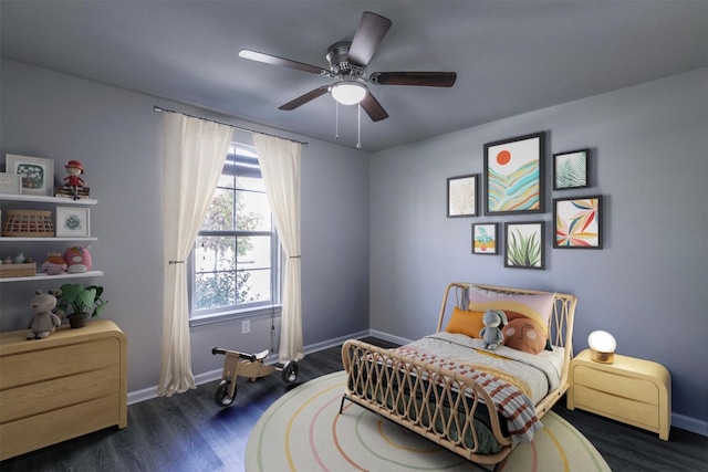 bedroom with ceiling fan and dark hardwood / wood-style flooring