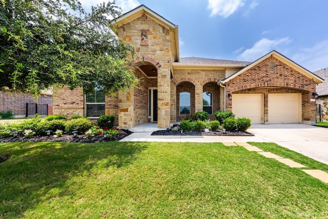 view of front of house featuring a front lawn and a garage