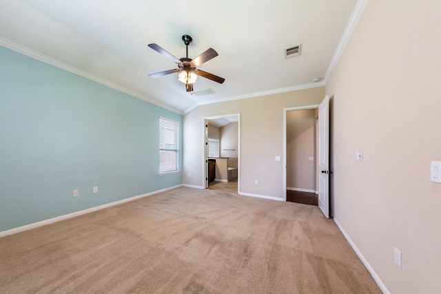 unfurnished bedroom with crown molding, connected bathroom, light carpet, and ceiling fan