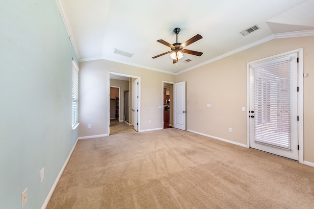 carpeted empty room with ceiling fan, ornamental molding, and lofted ceiling