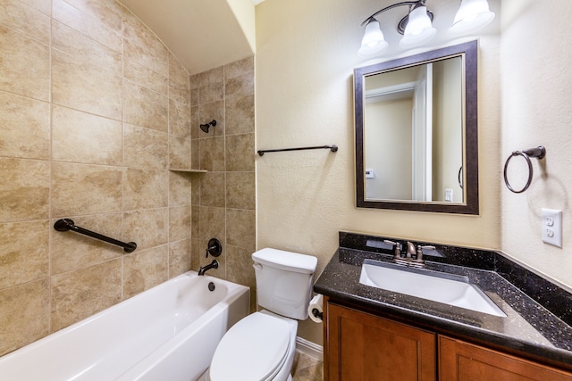 full bathroom featuring lofted ceiling, vanity, tiled shower / bath combo, and toilet