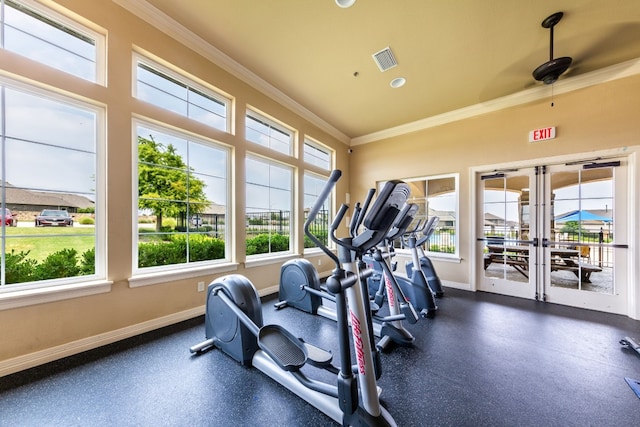 workout area with crown molding, ceiling fan, and french doors