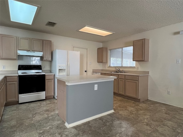 kitchen with a kitchen island, a textured ceiling, a skylight, sink, and white appliances