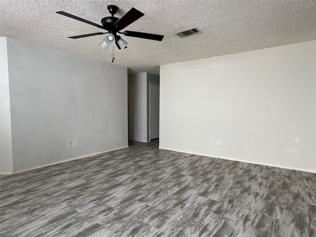 spare room featuring a textured ceiling, hardwood / wood-style flooring, and ceiling fan