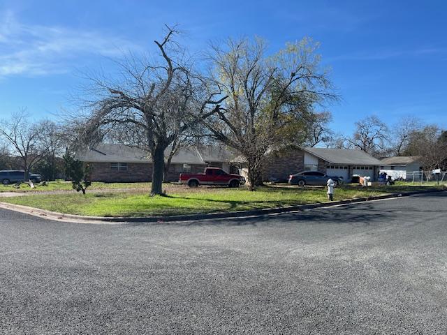 exterior space with driveway and an attached garage