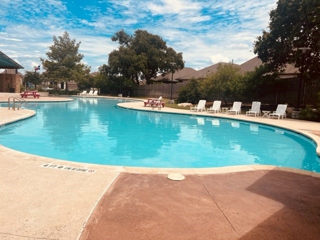 view of swimming pool featuring a patio