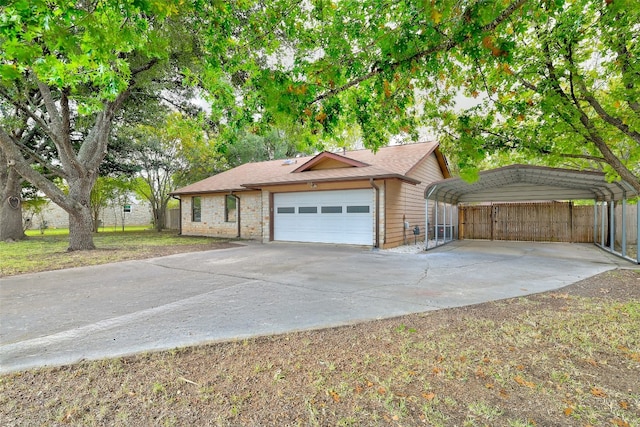 view of front of house with a garage and a carport