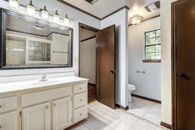 bathroom with vanity, crown molding, toilet, and tile patterned flooring