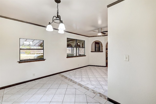 tiled empty room featuring ornamental molding and ceiling fan with notable chandelier