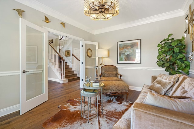 living room featuring crown molding and dark hardwood / wood-style flooring