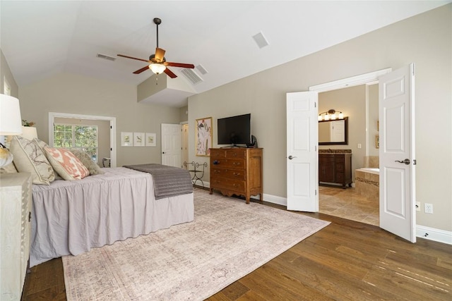 bedroom with ceiling fan, vaulted ceiling, wood-type flooring, and ensuite bathroom