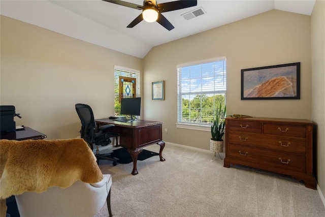 carpeted office space featuring ceiling fan and vaulted ceiling