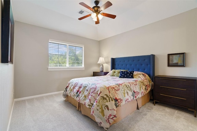 carpeted bedroom featuring ceiling fan and vaulted ceiling