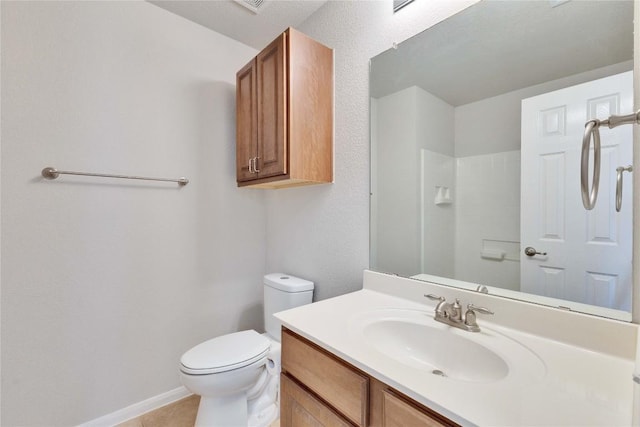 7537 S Glenn St, Austin, TX 78744 - bathroom featuring toilet, vanity, tile patterned floors, and baseboards