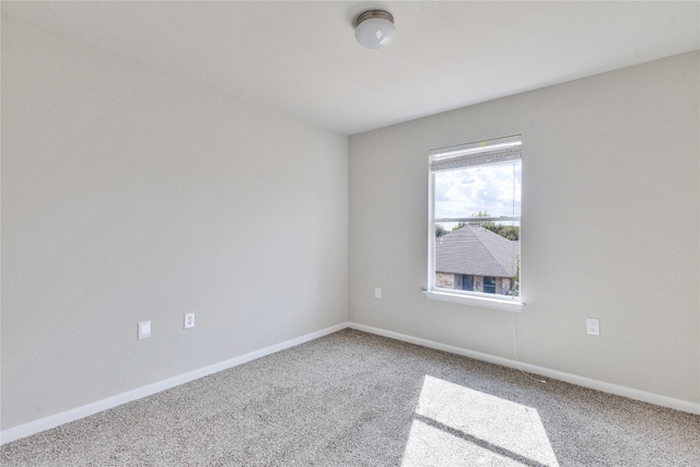 empty room featuring carpet flooring