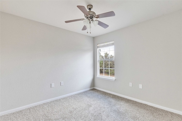 spare room with ceiling fan and carpet floors