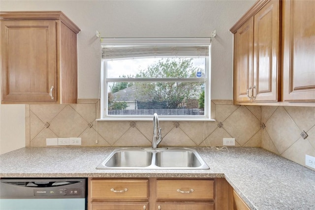 7537 S Glenn St, Austin, TX 78744 - kitchen with dishwashing machine, a sink, light countertops, and decorative backsplash