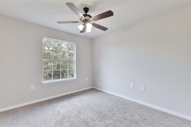 unfurnished room with ceiling fan and carpet floors