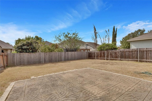 7537 S Glenn St, Austin, TX 78744 - fenced backyard with a patio area
