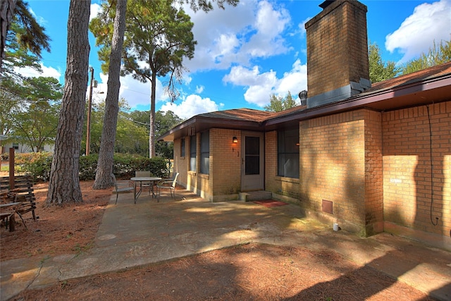 rear view of property featuring a patio area