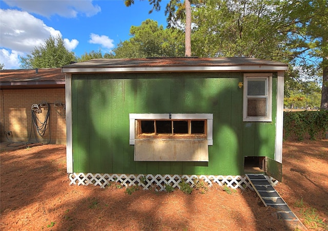 view of property exterior featuring an outdoor structure