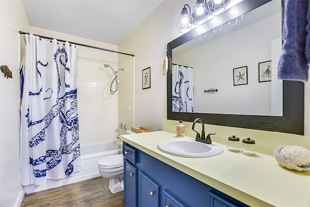 full bathroom featuring toilet, hardwood / wood-style flooring, vanity, and shower / tub combo