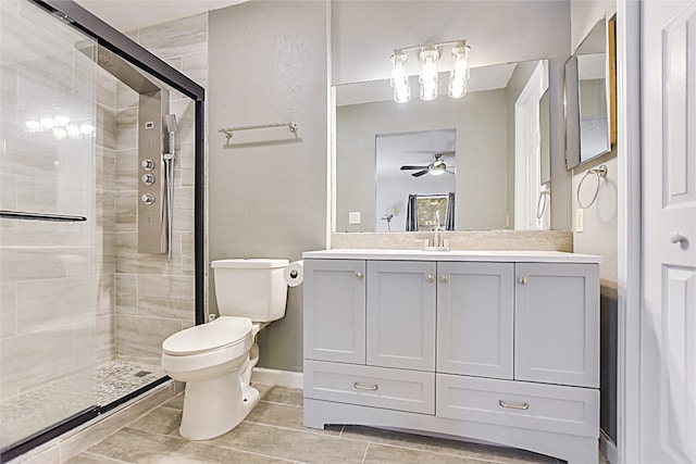 bathroom with vanity, toilet, tile patterned floors, and an enclosed shower