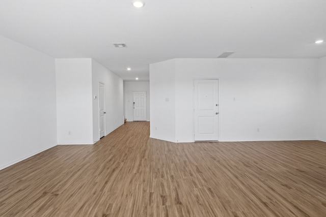 spare room with light wood-type flooring