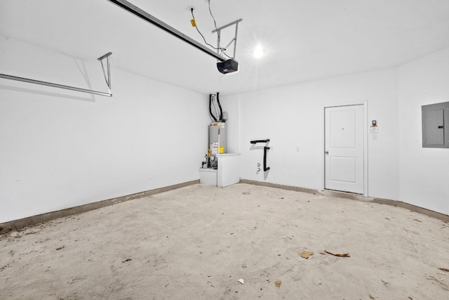 garage with a garage door opener, electric panel, and gas water heater