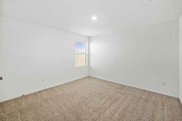 unfurnished room with carpet flooring