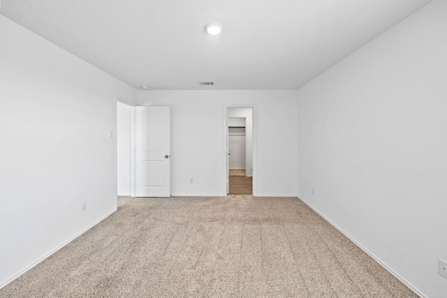 spare room featuring carpet flooring