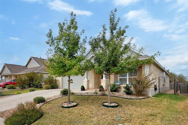 view of property hidden behind natural elements with a front lawn and a garage