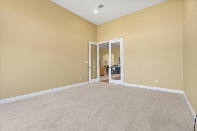 18201 Hewetson Cv, Austin, TX 78738 - carpeted spare room featuring french doors, baseboards, and recessed lighting
