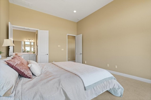 18201 Hewetson Cv, Austin, TX 78738 - carpeted bedroom featuring baseboards, vaulted ceiling, and ensuite bathroom