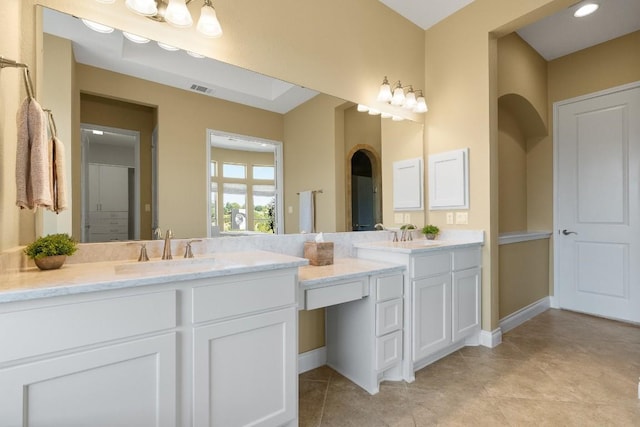 18201 Hewetson Cv, Austin, TX 78738 - bathroom featuring double vanity, tile patterned flooring, and a shower with door