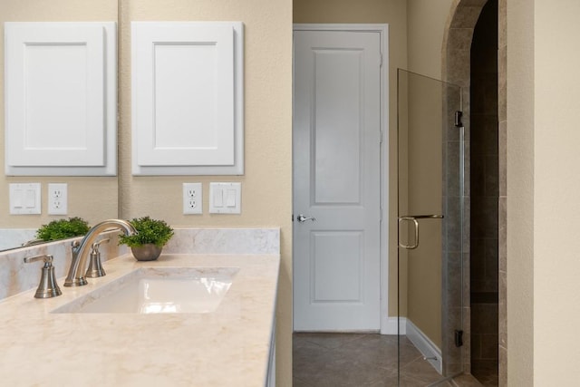 18201 Hewetson Cv, Austin, TX 78738 - bathroom with tiled shower, tile patterned flooring, and vanity