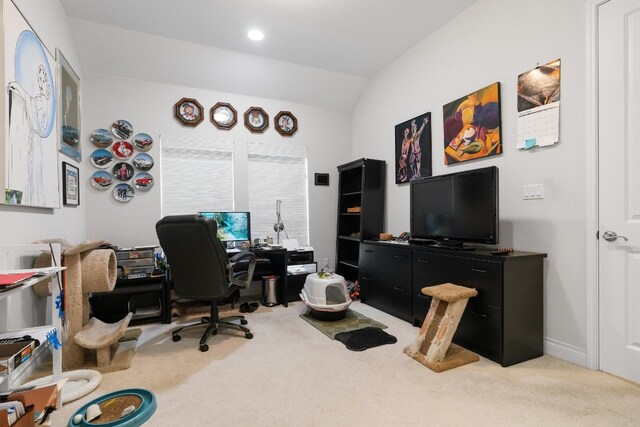 office featuring light carpet and lofted ceiling