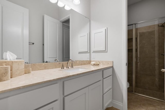 18201 Hewetson Cv, Austin, TX 78738 - bathroom with a stall shower, vanity, and toilet