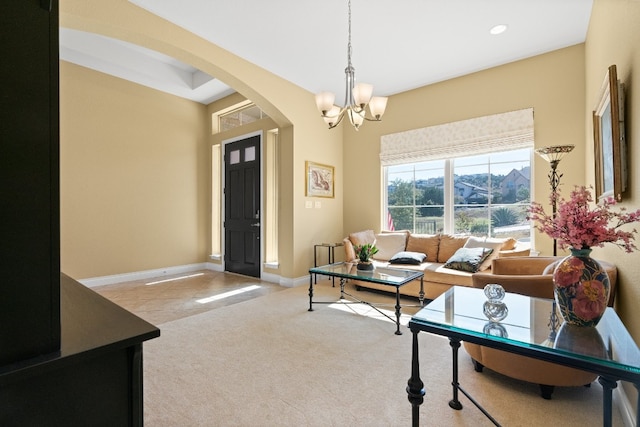 living room with light carpet and an inviting chandelier