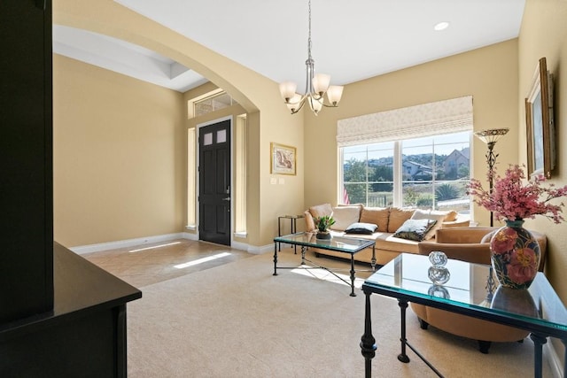 18201 Hewetson Cv, Austin, TX 78738 - living area with arched walkways, a chandelier, carpet floors, baseboards, and recessed lighting