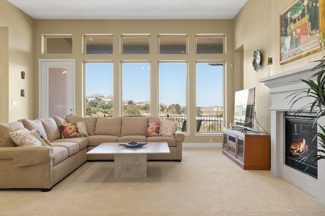 living room featuring a healthy amount of sunlight and light colored carpet