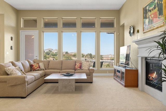 18201 Hewetson Cv, Austin, TX 78738 - living area featuring a glass covered fireplace and carpet