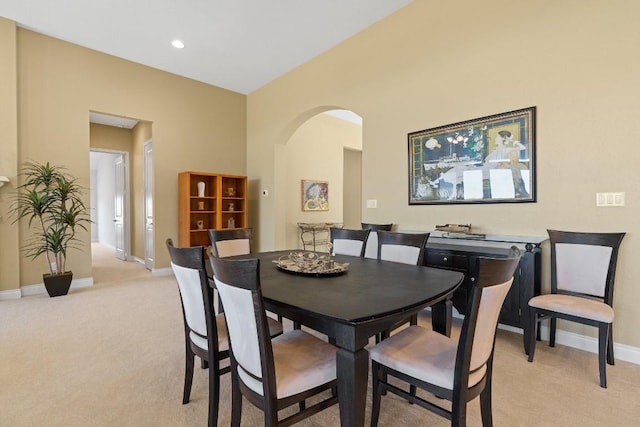 18201 Hewetson Cv, Austin, TX 78738 - dining area with light carpet, baseboards, and arched walkways
