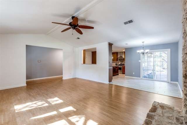 unfurnished living room with ceiling fan with notable chandelier, vaulted ceiling with beams, and light hardwood / wood-style flooring