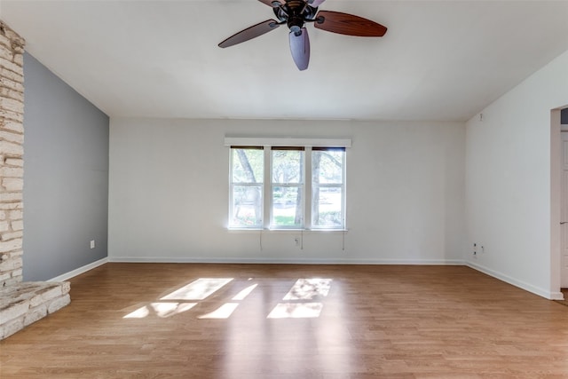 spare room with light hardwood / wood-style floors and ceiling fan