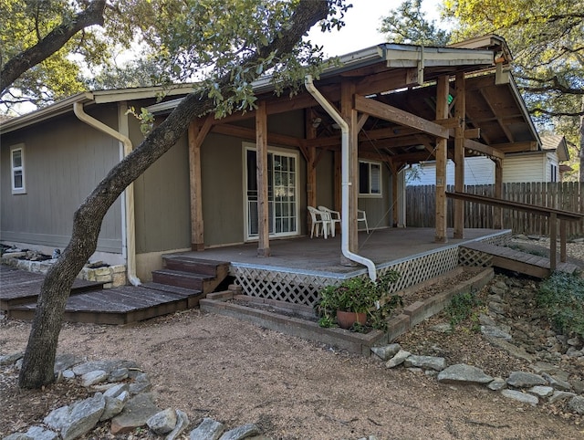 rear view of property with a patio area and a wooden deck