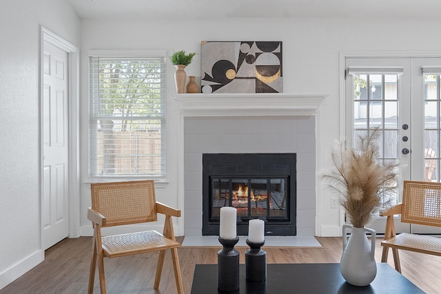 sitting room featuring a fireplace and wood-type flooring