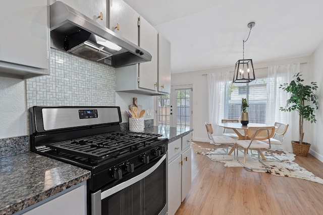 kitchen with white cabinetry, stainless steel gas stove, and light hardwood / wood-style floors