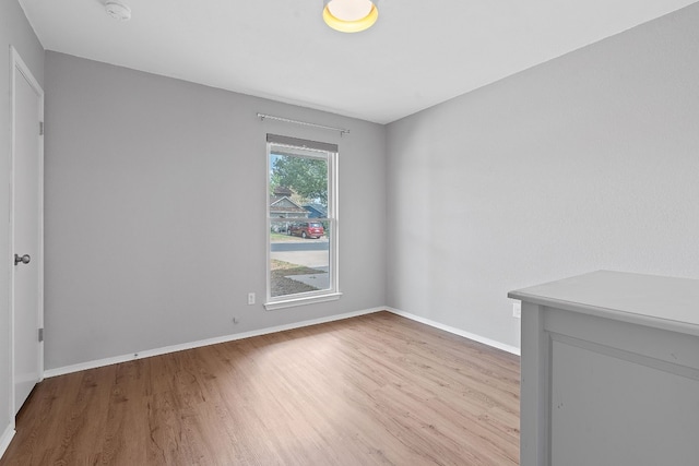 spare room with light hardwood / wood-style flooring