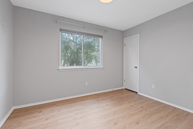 empty room with light hardwood / wood-style floors